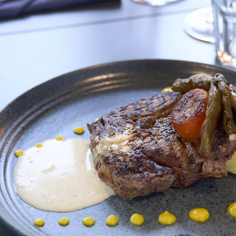 Grilled fillet on slate, mushroom butter sauce